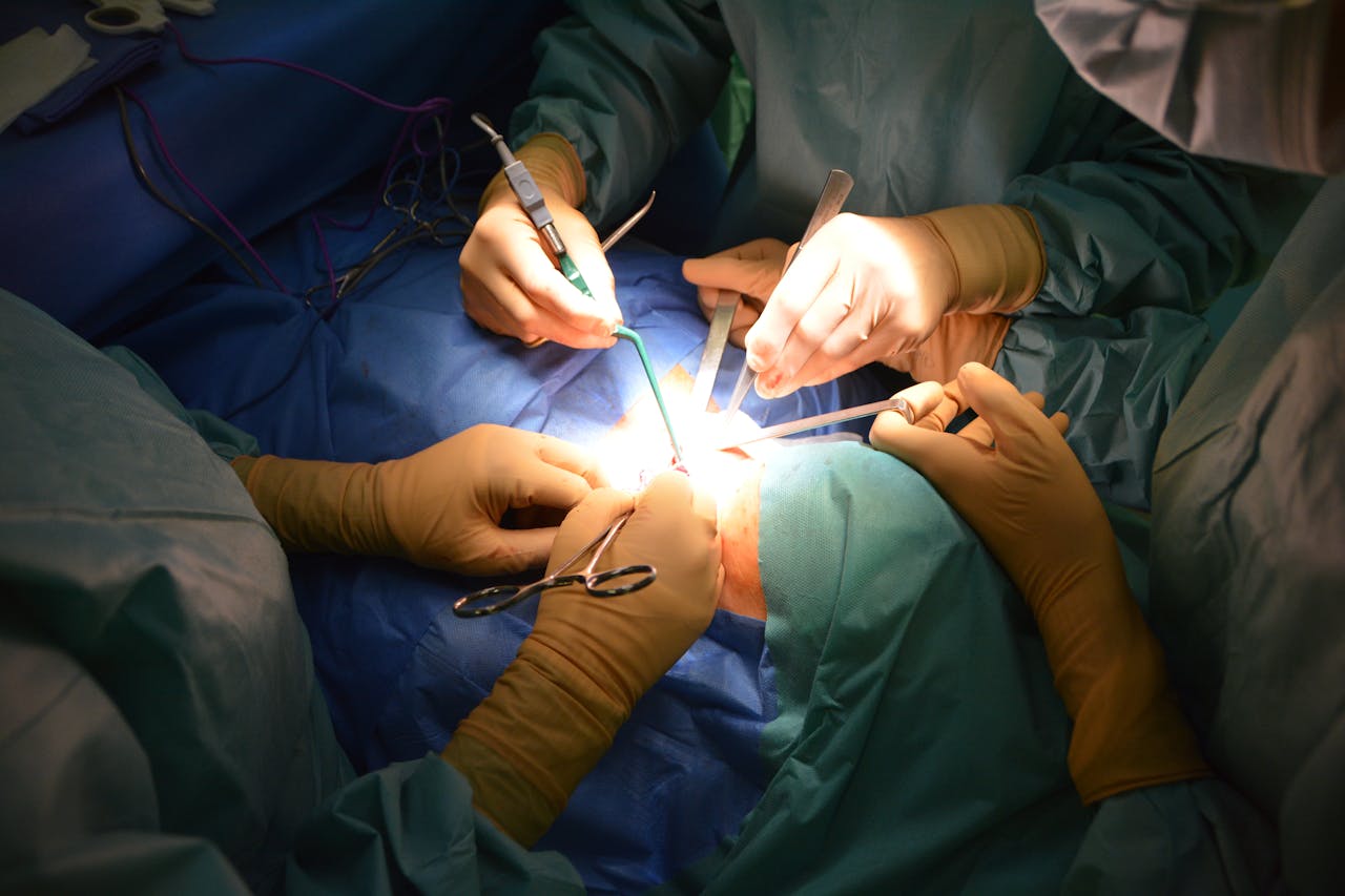 Close-up view of surgeons in an operating room performing a surgery with precision.